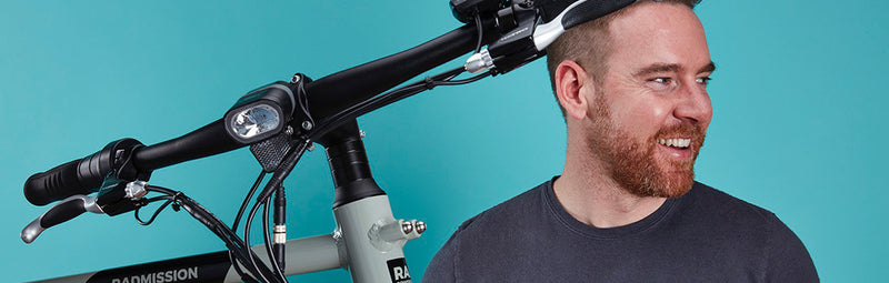 Rad Power Bikes CEO and founder Mike Radenbaugh next to a RadMission electric metro bike.