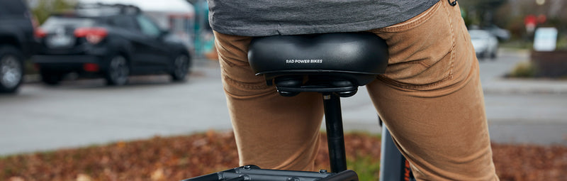 A rider using a Rad Power Bikes comfort saddle.