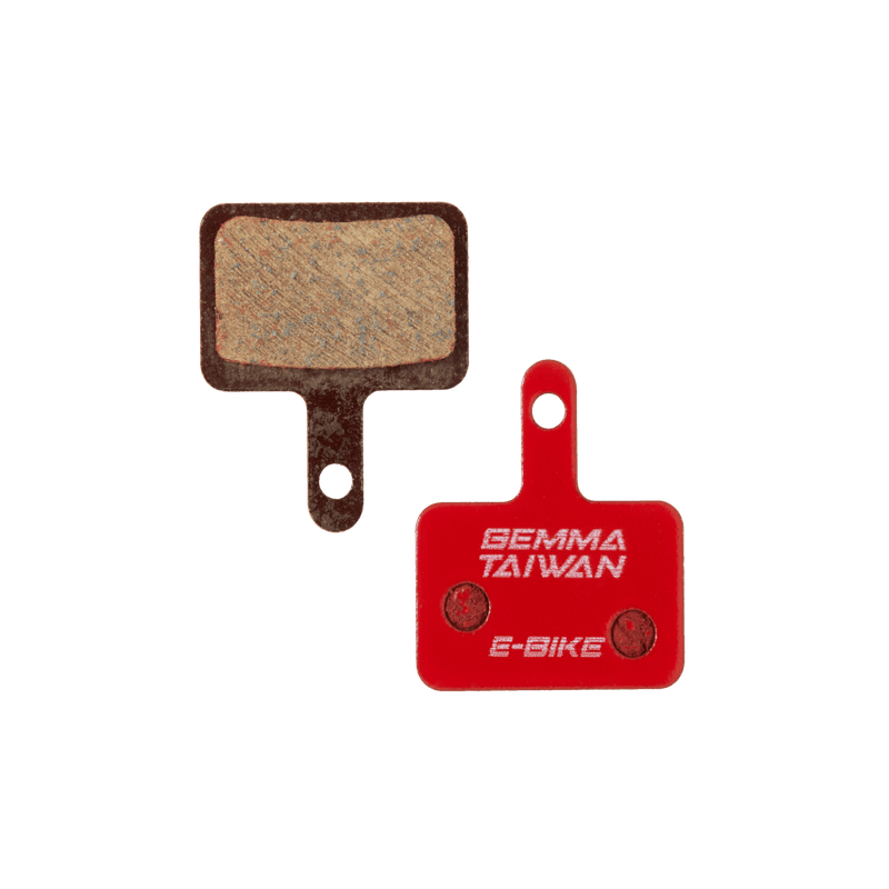 Front and back of the Gemma, G2, Semi-metallic brake pads. The back of the pad is bright red and has "Gemma Taiwan E-bike" stamped on it.