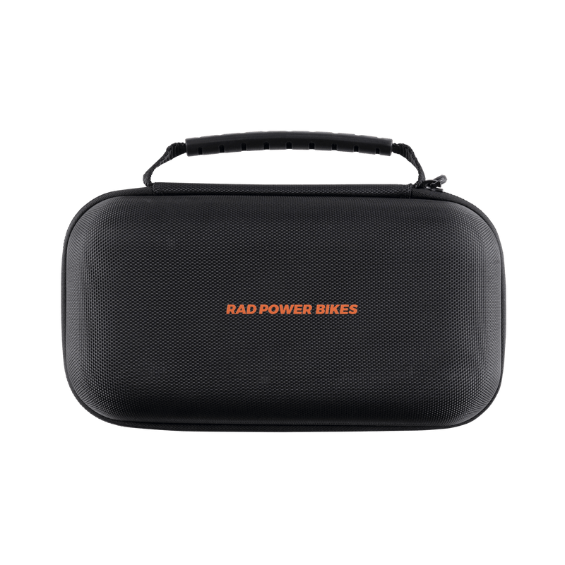 Carrying case with handle for the rad portable tire inflator with Rad Power Bikes written in orange. 