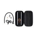 A Rad Portable Tire Inflator carrying case is being held by the handle and placed into a black pannier bag on an ebike. 