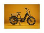 The right side of a deep emerald green electric bike with the kickstand down against a gold background.