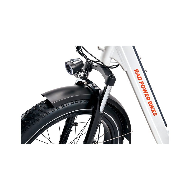 Close up of black RadMini Full Fender on front wheel of a white RadMini ebike.