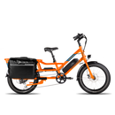 Full side view of an orange RadWagon with a fully-loaded black Ballard Cargo Bag on the rear rack.