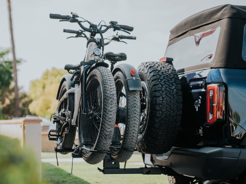 Two ebikes on a Hollywood Racks Sport Rider rack on the back of a vehicle